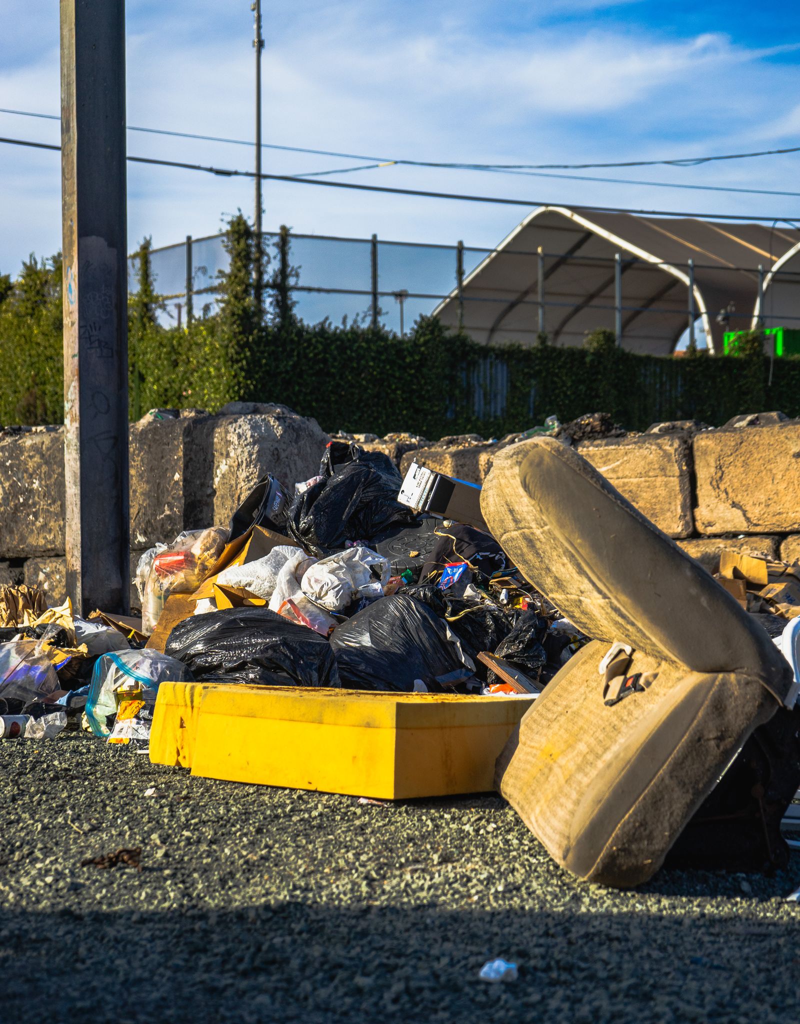Stock photo of a discarded mattress in an outdoor trash pile. Not a D.C. DPW photo.